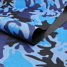 a blue and black camouflage print fabric