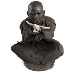 a statue of a man with a goat skull in his hand, on a white background