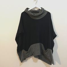 Nwot Oversized Fit Measurements: 35 Bust, 28 Length Two Front Pockets Grey/Black Black Batwing Sleeve Tops For Loungewear, Oversized Black Top For Layering, Black Slouchy Tops For Layering, Slouchy Black Tops For Layering, Casual One-size Poncho For Layering, Oversized Black Tops With Funnel Neck, Oversized Black Funnel Neck Tops, Oversized Black Chic Poncho, Black Oversized Chic Poncho