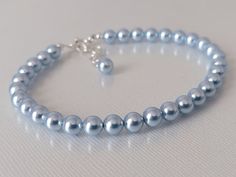 This is a RESERVED listing for Special Customer! Wedding Light Blue Blush Blue Colored Pearl Silver Dainty Bridal Bracelet. BRACELET is about 8 inches (20.3cm) long plus 1 inch extender chain. BRACELETS SECTION: https://www.etsy.com/shop/LanaChayka?ref=simple-shop-header-name&listing_id=892586384&sort_order=date_desc§ion_id=14226470 BRIDAL BRACELETS SECTION: https://www.etsy.com/shop/LanaChayka?ref=seller-platform-mcnav§ion_id=25839214 Classic and elegant, this dainty bracelet is perfect for wed Elegant Adjustable Light Blue Crystal Bracelet, Adjustable Blue Beaded Bracelets For Wedding, Elegant Light Blue Adjustable Crystal Bracelet, Elegant Adjustable Blue Pearl Bracelet, Elegant Blue Adjustable Pearl Bracelet, Adjustable Blue Crystal Bracelet For Wedding, Blue Round Beads Bracelet For Wedding, Blue Beaded Bracelets For Weddings, Blue Round Bead Bracelets For Weddings