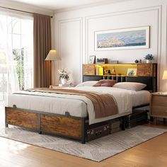 a bedroom with a bed, nightstands and two lamps on either side of the bed