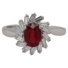 With this ring, you can be sure to grab everyone's attention. This piece is made up of a glass filled ruby stone and diamond stones in an antique style setting. The combination of these materials and the design of this ring make it stand out from the crowd and look especially beautiful on anyone's hand. This ring contains 0.44 carats total weight of diamonds, 1.21 carats total weight of ruby stones and 3.70 grams in weight. Allure Jewellery Mfg. Co., Ltd. stands out due to its quality, expertise Dazzling Oval Ruby Ring, Red Diamond Ring With Baguette Cut, Classic Cluster Ruby Ring With Center Stone, Classic Ruby Cluster Ring With Center Stone, Timeless Oval Ruby Ring With Diamonds, Platinum Ruby Ring With 17 Jewels, Formal Cluster Ruby Ring, Oval Ruby Ring With Diamond Center Stone, Classic Cluster Ruby Ring