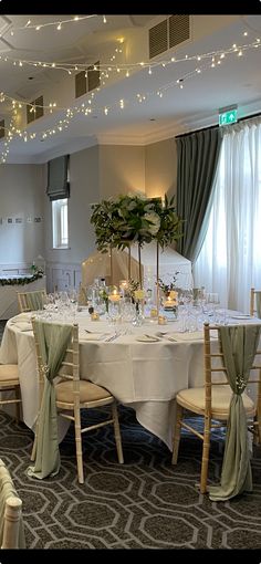 a banquet room set up with tables and chairs