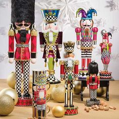 nutcrackers, figurines and other decorations on a table