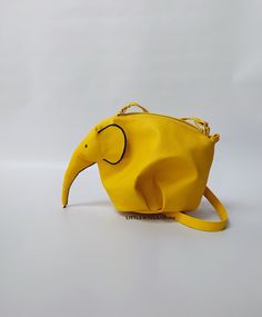 ♥Limited edition! This listing is for one lemon-yellow ECO leather elephant bag! One of the best accessories bohemian cross-body bag is truly unique! Perfect for your personal objects, coins, decorative objects, jewelry, or other valuable items and accessories such as electronic devices (smartphones, chargers...) This clutch is very strong and durable, fashionable, classic but very stylish, perfect for your daily life, for a unique look, special occasions or events, etc. This is my favorite purs Yellow Mobile Phone Bag As Gift, Yellow Handheld Bags For Daily Use, Yellow Pouch Bag For Mobile Phone, Yellow Pouch Shoulder Bag With Mobile Phone Pocket, Yellow Satchel With Removable Pouch For School, Yellow Crossbody Bag Gift, Yellow School Satchel With Removable Pouch, Handheld Yellow Bags For Daily Use, Yellow Tote Satchel With Mobile Phone Bag