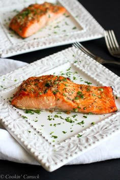 a piece of salmon on a white plate