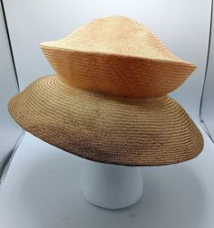 A signed handmade 2-tone raffia sunhat by millinery artist Patricia Shypertt in Hood River Oregon. Shypertt makes hats that are lightweight, packable and highly unique for their shape and collapsibility. This is a one size fits a all hat that has a strtetchability factor in the material.  In perfect condition. (Note: Picture #3 is another hat from the hat for sale here -- same hat in different color - just to show how it is worn) Natural High Crown Toquilla Straw Hat, High Crown Toquilla Straw Hat For Summer, Toquilla Straw High Crown Hat For Summer, Summer High Crown Straw Hat, Summer Straw Hat With High Crown, Natural High Crown Straw Hat For Summer, High Crown Natural Sun Hat For Summer, Hood River Oregon, Hood River