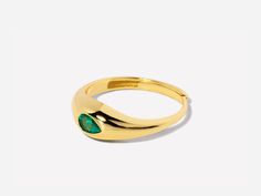 A gorgeous design, this cocktail ring is boldly unexpected. Stunning in its simplicity, the ring features an inlay pear-shaped emerald beautifully set in a gold band that packs a punch. Emerald stone size: 3mm x 5mm; Band is made of 14k gold over sterling silver. Adjustable band between size 7-9 Hypoallergenic, nickel and lead free Tarnish resistant Caro Emerald, Dome Ring, Domed Ring, Emerald Stone, Stone Design, Gold Filled Jewelry, Gorgeous Design, Gold Band, Cocktail Ring