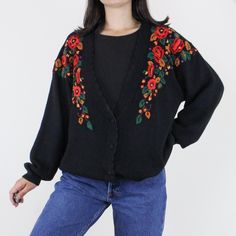 Item Description  This is such a lovely vintage 90s floral embroidered heavyweight knit cardigan! I just love the warm autumn tones of the embroidery, and the comfy slouchy fit! This one is a quality ramie cotton blend, button front with a deep v-neckline, and marked a size L. It is in great vintage condition!! Item Specifics  Brand - Separate Issue Material - 55% Ramie 45% Cotton Color - Black w/ red, orange, gold, purple floral & green leaves Measurements  Shoulder to Hem - 30 in.  Sleeve Leng Vintage Black Sweater For Spring, Vintage Floral Print Cardigan For Fall, Fall Vintage Floral Print Cardigan, Black Vintage Sweater For Spring, Vintage Embroidered Fall Sweater, Vintage Black Cardigan For Spring, Vintage Floral Print Winter Cardigan, Vintage Floral Print Cardigan For Winter, Vintage Winter Floral Cardigan