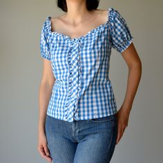 Amazing vintage blouse shirt with cute frills around collar and button placket, puffy sleeves. Korean style plaid in blue and white. Can be adjusted to your waist at the back - see photo. COMPOSITION 100% Cotton SIZE Best fir for M/L (Medium/Large) sizes, see measurements below MEASUREMENTS Chest: 51cm = 20.1" Waist: 45cm = 17.7" (can be adjusted at the back) ✂ ---Items are measured laying flat seam to seam and should be doubled for bust, waist and hips Casual Gingham Puff Sleeve Blouse, Casual Gingham Blouse With Puff Sleeves, Fitted Gingham Blouse With Puff Sleeves, Plaid Puff Sleeve Cotton Top, Plaid Cotton Top With Puff Sleeves, Fitted Plaid Puff Sleeve Blouse, Plaid Fitted Blouse With Puff Sleeves, Fitted Plaid Blouse With Puff Sleeves, Cute Blue Puff Sleeve Blouse