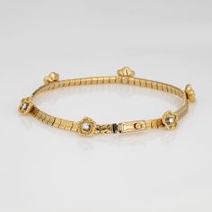 This is part of Chairish’s Fine Jewelry assortment.   Finely detailed vintage diamond flower bracelet (circa 1950s to 1960s), crafted in 14k yellow gold.   6 round brilliant cut diamonds total an estimated 0.15 carats (estimated at I-J color and VS2-SI2 clarity). The stylish bracelet features 6 raised diamond set floral mounts, set upon a smooth-to-the-touch concave link bracelet.  Great worn alone or layered with your other favorite pieces.    The bracelet is in very good original condition and Gold Flower Bracelet, Stylish Bracelet, Gold Bracelet Chain, Diamond Flower, Gold Flower, Diamond Set, Flower Bracelet, Best Wear, Vintage Diamond