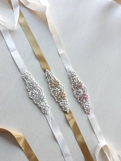 A very sparkly skinny sash for your flower girl! This sparkly sash is in silver tone setting with clear crystals encrusted all over for maximum sparkle with ivory cream champagne satin 25mm ribbon which could be changed to any colour you like.  The embellished part measures a little over 6 1/2 inch long. The sash is about 2 meters which could be easily cut to size and then heat sealed to avoid fraying. Coordinating items are also available in my shop and I do offer shipping discount on multiple Silver Bridesmaid Sashes Bridal Accessories, Silver Crystal-embellished Bridesmaid Sash, White Rhinestone Sashes For Bridesmaids, White Crystal Embellished Sash, Silver Rhinestone Bridal Belt For Prom, White Crystal Embellished Sashes, White Rhinestones Bridesmaid Bridal Accessories, White Embellished Crystal Sashes, White Bridesmaid Sash With Rhinestones