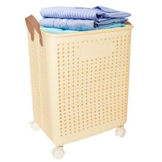 a laundry hamper with clothes on top of it and wheels to the side, isolated against a white background