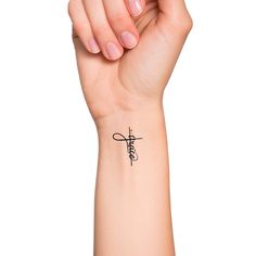 a woman's wrist tattoo with the word jesus on it