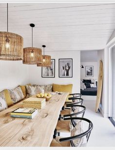 a long wooden table with chairs around it