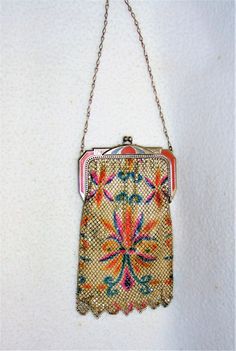 Presented today for sale is an antique Whiting and Davis Dresden enameled mesh purse from the 1920's. This is one of the most colorful ones we have seen starting with the Art Deco style enameled deco frame in orange and blue to the very colorful pattern on both sides of the purse! Marked inside the frame of the purse as shown and it also has it's original silk lining inside...fragile but there :) Very hard to take good pictures but there is very minor paint loss throughout as this has been kept Antique Handmade Multicolor Bags, Antique Multicolor Handmade Bags, Antique Multicolor Rectangular Bag, Antique Multicolor Rectangular Bags, Antique Style Multicolor Evening Bags, Take Good Pictures, Good Pictures, Deco Art, Bags Purses