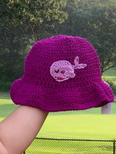 Cute BTS whalien crocheted bucket hat made with acrylic yarn for the hat and cotton yarn for the whalien applique. Fits the average medium adult head size. Purple Crochet Beanie For The Beach, Purple Crochet Beanie For Beach, Handmade Purple Crochet Hat With Curved Brim, Casual Purple Crochet Bucket Hat, Casual Purple Brimmed Crochet Hat, Purple Crochet Yarn Bucket Hat, Purple Yarn Bucket Hat, Purple Yarn Crochet Bucket Hat, Crocheted Bucket Hat