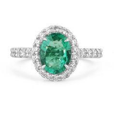 This is an exquisite, Zambian emerald and diamond halo ring. The gorgeous setting lets sit an excellent quality emerald with beautiful color and very good eye clarity. The emerald is not perfect and small imperfections do exist as it is a natural gemstone. Near colorless diamonds halo around the emerald and down the shank! This ring is incredibly comfortable to wear and would be an ideal engagement ring! Setting Style: Prong/Pave/Halo Setting Material: 14K White Gold Setting Weight: 3.9 Grams Ma Gia Certified Oval Emerald Cluster Ring, Oval Emerald Ring With Halo Design, Gia Certified Oval Emerald Halo Ring, Oval Emerald Cluster Ring With Halo Design, Green Oval Diamond Halo Ring, Oval Green Diamond Halo Ring, Oval Emerald Halo Ring In Fine Jewelry Style, Oval Emerald Halo Ring Fine Jewelry, Oval Emerald Ring With Halo Diamond Setting