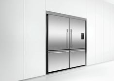 a stainless steel double door refrigerator in a white kitchen with black trimmings on the doors