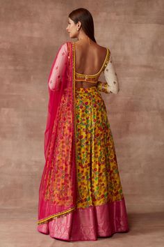 Ochre lehenga in kalamkari block print of nature-inspired floral and hot pink banarasi woven panel. Paired with blouse in multicoloured bead work. Comes with a coin worked borders tulle dupatta.
Component: 3
Pattern: Printed
Type Of Work: Kalamkari
Neckline: Square
Sleeve Type: Long Sleeves
Fabric: Chanderi Silk
Color: Yellow
Other Details: 
Embroidered blouse
Sheer dupatta
Kalamkari print
Banarasi woven panel
Occasion: Sangeet, Destination Wedding - Aza Fashions Transitional Yellow Chanderi Choli, Chanderi Sets With Motifs For Reception, Block Print Lehenga For Navratri, Transitional Yellow Lehenga With Cutdana, Fitted Sharara With Motifs And Traditional Drape, Semi-stitched Yellow Choli For Transitional Season, Bollywood Lehenga With Motifs For Transitional Season, Fitted Lehenga With Motifs For Transitional Season, Semi-stitched Floor-length Choli With Motifs