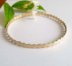 Gold bangles 14k, stacking bracelets gold, 14k gold bangle bracelet, vintage gold bracelet, 14k gold bridesmaid bracelet, bridal bangle bracelets Gold bangle 14k gold plated, made of small circles set in a row and soldered to one another, creating a vintage style hoop bracelet. This gold bracelet is 100% handmade and is unique and elegant. Dimensions: This gold, bridal bangle bracelet is available in 3 different sizes: Small (S), Medium (M) , Large (L) and Extra large (XL). Small - diameter of 6 Hoop Bracelet, Gold Bridesmaid Bracelet, 14k Gold Bangle Bracelet, Vintage Gold Bracelet, Stacking Bracelets, Bracelets Gold, Bridal Bangles, Bridesmaid Bracelet, Gold Bangle Bracelet