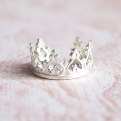 Item #294 Features a crown designed ear cuff made completely of sterling silver. Ear cuff requires no piercing. - Ear cuff diameter is approximately 9-10mm Other crown ear cuffs: https://www.etsy.com/listing/106412568/sterling-silver-majesty-crown-ear-cuff https://www.etsy.com/listing/111185897/sterling-silver-royalty-crown-ear-cuff Also check out my site at http://www.simplicitycharms.com for more items I have not listed. Silver Dainty Jewelry With Crown Design, Dainty Silver Jewelry With Crown Design, Silver Jewelry With Structured Crown Design, Sterling Silver Crown Jewelry, Adjustable Crown Design Jewelry, Silver Princess Crown, Royalty Crown, Homemade Face Paints, Diy Flower Crown