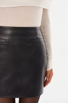 The ROWAN Leather Skirt is a versatile wardrobe staple, effortlessly transitioning from day to night. Made from premium lamb leather, it showcases a sleek design with front pockets and a flattering fit. Pair it with the matching LINETTE Leather Jacket for an elegant take on leather suiting. Versatile Wardrobe, Leather Mini Skirt, Day To Night, To Night, Leather Mini Skirts, Swim Accessories, Leather Mini, Skirt Pants, Summer Sale