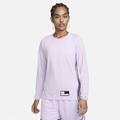 Bring your focus to the basketball court in this sweat-wicking warm-up top. Its lightweight fabric combines with an easy fit so you can pass and pivot feeling free. Purple Relaxed Fit Sporty Tops, Moisture-wicking Crew Neck Basketball Top, Functional Purple Sports Top, Purple Go-dry Athleisure Top, Nike Sweat Resistant Tops For Sports Season, Sporty Moisture-wicking Tops For Basketball, Purple Athleisure Tops For Sports, Nike Athleisure Tops For Sports Events, Sporty Purple Moisture-wicking Top