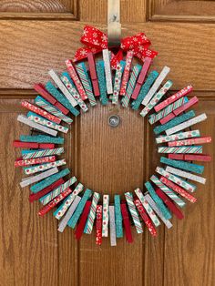 a wreath made out of books on the front door