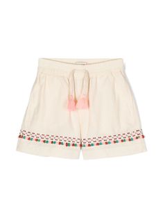 Casual Spring Shorts With Tassels, Casual Tassel Shorts For Spring, Cream Cotton Summer Shorts, Summer Cream Cotton Shorts, White Bottoms With Tassels For Spring, Embroidered Cotton Shorts For Vacation, Embroidered Cotton Beach Shorts, Beach Embroidered Cotton Shorts, Cotton Bottoms With Tassels For Vacation