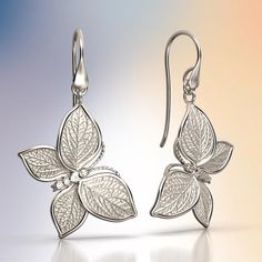 Experience Italian craftsmanship at its finest with our exquisite gold dangle drop earrings. The centerpiece of these earrings is a delicate butterfly with elegantly crafted leaves as its wings, creating a captivating and nature-inspired design. Available in both 14k and 18k gold, these earrings bring a touch of luxury and nature's beauty to your style. Elevate your look with the perfect blend of Italian artistry and organic elegance, shop now to adorn yourself with this unique masterpiece. 14k Delicate Butterfly, Italian Craftsmanship, Italian Jewelry, Nature Inspired Design, Gold Butterfly, Gold Earrings Dangle, Sashiko, Gold Yellow, Nature Beauty