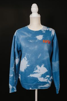 This bleach dyed unisex heavy blend crewneck sweatshirt is pure comfort. Inspired by the NASA logo, perfect for any space fan. Each item is handmade and packaged with love, care, and attention to detail. This super cute, and unique reverse tie-dye sweatshirt is made to order. No two will look the same, so you are guaranteed to have a unique look!  Ideal for any situation, a unisex heavy blend crewneck sweatshirt is pure comfort. These garments are made from polyester and cotton. This combination helps designs come out looking fresh and beautiful. The collar is ribbed knit, so it retains its shape even after washing. There are no itchy side seams on these sweaters. NASA, NASA Sweatshirt, Space, Science, Astronaut, merchandise, Holiday gifts, Iconic gifts, Casual Wear, Streetwear, Loungewear Streetwear Outfit Men, Nasa Sweatshirt, Streetwear Loungewear, Space Logo, Nasa Logo, Reverse Tie Dye, Dye Sweatshirt, Bleach Dye, Tie Dye Sweatshirt