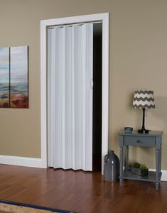 The Spectrum Via accordion door comes with track, hardware and straightforward installation instructions. Ideal for closets and entryways with space constraints, the door trims easily to any height and has reversible handing, allowing the option of installing two of these doors (priced separately) as a double door. The durable, maintenance-free vinyl panels have flexible vinyl hinges and a durable finish for enduring beauty and longevity, certain to provide many years of dependable performance. Spectrum Via 48-in x 80-in Reversible/Universal Handing White Vinyl Accordion Door (Hardware Included) | VS4880H Accordion Folding Doors, Mobile Home Doors, Pintu Interior, Accordion Door, Interior Design Blogs, Accordion Doors, Vinyl Panels, Folding Door, Glass Barn Doors