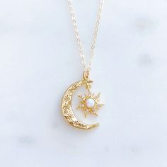 "DESCRIPTION: The AURORA Necklace - Gold crescent moon + opal sun pendant on a dainty gold filled chain. Wear it on its own for a celestial statement or layer it up with your favorite necklaces, either way your going to want to wear this beauty again and again. We love this celestial necklace and think you will too! MATERIALS: Chain, clasp, and jump rings - Gold filled Pendant - Gold plated, Opal, CZ stones PENDANT SIZE: Approximately 1\" in length PACKAGING: Your necklace will arrive on a Daint Sun And Moon Necklace Aesthetic, Celestial Opal Necklace As A Gift, Celestial Opal Necklace As Gift, Celestial Opal Necklace For Gift, Celestial Gold Opal Necklaces, Gold Opal Celestial Necklace, Celestial Gold Opal Necklace, Sun And Moon Jewelry, Moon And Sun Necklace