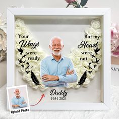 an image of a man with his arms crossed in front of a frame that says, your wings were ready daddy