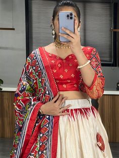 Elevate your ethnic wardrobe with our stunning "adorable off-white & red patola printed silk festival wear lehenga choli." Crafted from high-quality dola silk material in off-white and red colors, this traditional ensemble is adorned with intricate patola and paithni printed work, along with shimmering foil work (crush work) that adds a touch of glamour to the outfit.
This lehenga choli set include a lehenga stitched up to 42 inches with a 3.8-meter flair, a 41-inch lehenga length, and an un White Bandhani Print Sets With Traditional Drape, Ikat Print Traditional Drape Sets For Festivals, Traditional Drape Ikat Print Sets For Festivals, Ikat Print Traditional Wear For Weddings And Festivals, Bollywood Style Festive Ikat Print Traditional Wear, Festive Ikat Print Traditional Wear For Wedding, Ikat Print Sets For Navratri Puja, Navratri Ikat Print Sets For Puja, Bollywood Style Festive Traditional Wear With Ikat Print