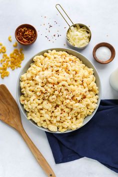 a bowl of macaroni and cheese next to other ingredients