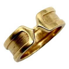 This is part of Chairish's Fine Jewelry Collection.  This 18k gold ring is a play on the classic double-c Cartier design. An abstracted c raises up as an exterior border that continues around the band. Two c’s back up against each other, meeting at a sharp point in the middle of the ring for a clean, modern look.  The outside border has a high polish, while the interior layer has a brushed gold finish. The design is subtle and simplistic, and the ring makes for an excellent staple in any jewelry Cartier Gold Ring, C Ring, Cartier Gold, 18k Gold Ring, Fine Jewelry Collection, Cartier Ring, Clean Modern, Bling Bling, Vintage Cartier