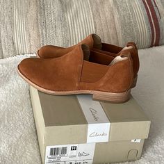 Clark’s Wdenvalr Page Dark Tan Suede Booties. Size 7 M. New With Tags In Box. Cushioned Suede Slip-on Slippers, Suede Slip-on Boots With Cushioned Footbed, Brown Suede Slip-ons With Removable Insole, Suede Slip-on Slippers With Buckle Closure, Suede Buckle Closure Slip-on Loafers, Womens Clarks, Clarks Shoes, Dark Tan, Tan Suede