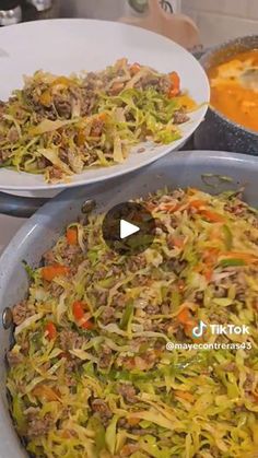 two pans filled with food sitting on top of a counter next to each other