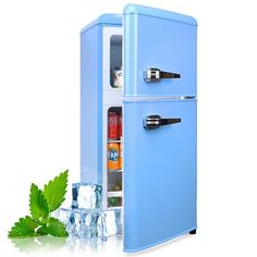 a blue refrigerator freezer sitting next to an ice bucket filled with mint leaves and bottles