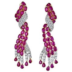 Beautiful earrings that resemble twisting Ruby and Diamond ropes. Set in 18k white and yellow gold the Oval and Pear-shape Rubies shine nicely off the diamond backcloth. Gold Oval Earrings, Noble Lady, Sparkling Jewelry, Vintage Drop Earrings, Diamond Earrings Studs Round, Nickel Free Earrings, Expensive Jewelry, Ruby Earrings, Ruby Jewelry