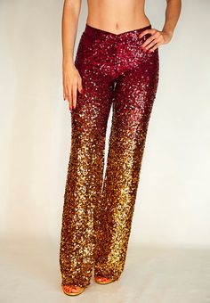 The GLAM PIECE MISSING IN YOUR WARDROBE / SuperSoft "V" SHAPE WAISTBAND + FULL BREATHABLE POWER MESH Crafted in limited edition and meticulously sewn in small batches, these luxurious palazzo pants are a vision of glam. Cascading like a golden waterfall of lush sequins, they seamlessly blend from a flattering ruby red to a rich gold hue. Designed with utmost attention to detail, the v-shaped waistband ensures a secure fit with a hidden ultra-soft elastic that sits just below the belly button, wh Fitted Pants For Christmas Party, Multicolor Sequin Party Pants, Multicolor Sequined Party Pants, Festive Fitted Red Pants, Festive Fitted Red Bottoms, Fitted Red Bottoms For Festive Occasions, Madonna Ray Of Light, Golden Waterfall, Sparkly Pants