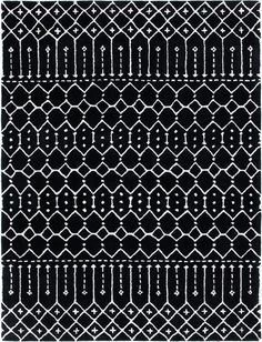 a black and white rug with an intricate design