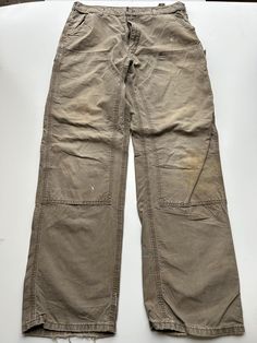 Mens Carhartt Double Knee Trouser Heavy duty material 1990s vintage  Regular Fit  Zip Fly  Grey Waist 36 inch Leg Length 34 inch **Sizes are exact measurement of the jean and may differ from the tag size** Please note due to the nature of these being workwear jeans there will be cool signs of fraying / paint and fading marks. All adding to the character of the piece** Item in great workwear condition overall Vintage Straight Leg Cargo Pants For Streetwear, Vintage Full Length Cargo Pants For Streetwear, Vintage Brown Cargo Pants, Vintage Straight Leg Work Pants For Streetwear, Vintage Cargo Pants For Streetwear, Vintage Pants With Belt Loops For Streetwear, Vintage Full-length Bottoms For Streetwear, Cool Signs, Pantalon Carhartt