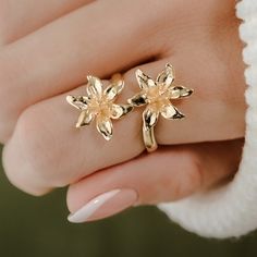 Title: Lily Ring  Story:  Elevate your style with the timeless beauty of our Lily Flower Ring, a mesmerizing piece of 3D printed jewelry that captures the essence of delicate lilies in bloom. Crafted with precision using advanced 3D printing technology, this adjustable ring showcases the intricate details of the flower petals, bringing a touch of natural elegance to your ensemble. With its adjustable design, this ring offers a comfortable and personalized fit, making it a versatile accessory for Gold Jewelry With 3d Petal Flowers, Lily Ring Jewelry, Flower Gold Ring, Lily Ring, Lily Jewelry, Gold Flower Ring, 3d Printed Jewelry, Printed Jewelry, Classy Jewelry