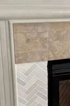 a fire place with a tile fireplace surround