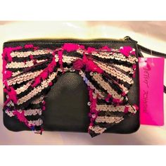 Betsey Johnson Fancy Bow Wristlet Black / White Black Pink Stripe Bow Brand New With Tag Size, Small Approx 7.5" Wide X 5" Tall Pink Floral Lining Inside Sequin Bow, In Colors, Pink, White And Black. Zip Closure Pink Pouch Clutch With Wrist Strap, Pink Clutch Wallet With Wrist Strap, Pink Clutch With Wrist Strap, Trendy Pink Clutch With Zipper Closure, Trendy Pink Clutch With Zipper, Black Clutch Wristlet For Gift, Black Wristlet With Zipper Closure For Gift, Black Wristlet With Zipper Closure As Gift, Trendy Wristlet Clutch With Wrist Strap