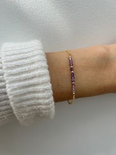 Beautiful crystals are combined with a dainty chain to create this beautiful bracelet.  Amethyst has been renowned for its beauty throughout the ages and is also the birthstone for anyone born in the month of February. D E T A I L S  *It features micro- faceted  shaded amethyst gemstones - separated by seamless gold filled/sterling silver beads. *Beads measure around 2.75mm and originate from Brazil. *Choose between and 18k gold filled chain, rose gold filled or 925 sterling silver chain. *Gold filled is a wonderful alternative to solid gold and unlike gold plating does not rub off. *It closes with a hall marked gold filled/sterling silver spring clasp. *Bracelet comes care instructions and a matching crystal information card and is ready for gifting. S I Z I N G * H E L P Choose the lengt Elegant Purple Birthstone Beaded Bracelets, Adjustable Amethyst Beaded Bracelets With Birthstone, Purple Beaded Birthstone Bracelets As Gift, Purple Birthstone Beaded Bracelets As Gift, Purple Beaded Birthstone Bracelets For Gift, Purple Birthstone Beaded Bracelets For Gift, Dainty Handmade Purple Bracelets, Purple Amethyst Birthstone Bracelet, Elegant Adjustable Purple Chain Bracelet