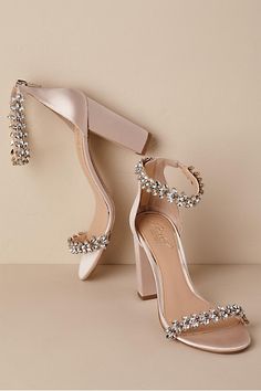 a pair of women's high heeled shoes with crystal embellishments